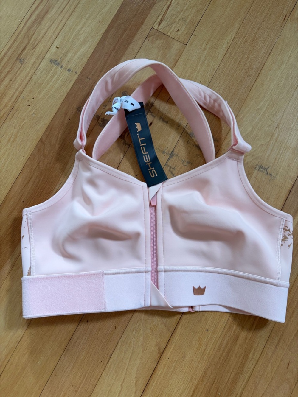 SHEFIT Women’s Front-Zip Sports Bra in Pale Pink